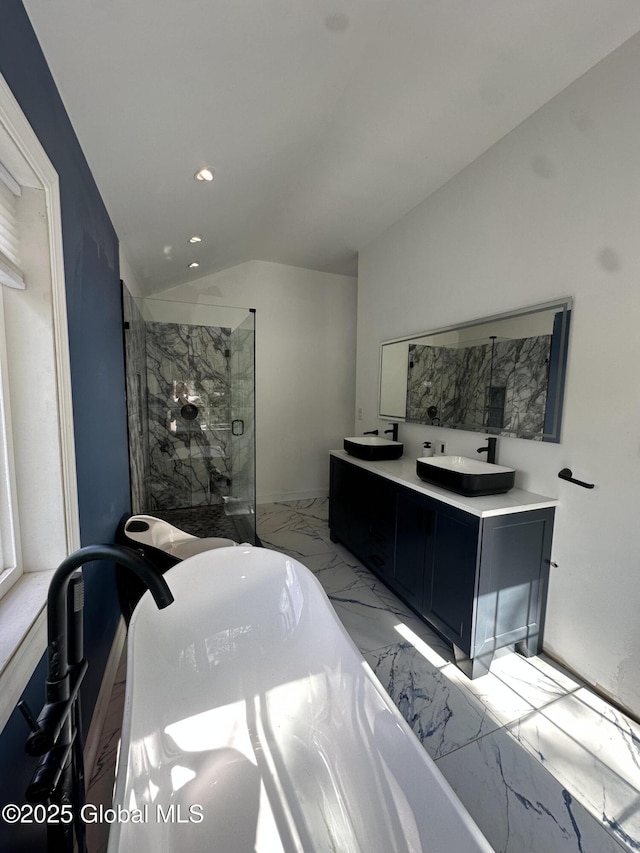 full bath with marble finish floors, a walk in shower, lofted ceiling, double vanity, and recessed lighting
