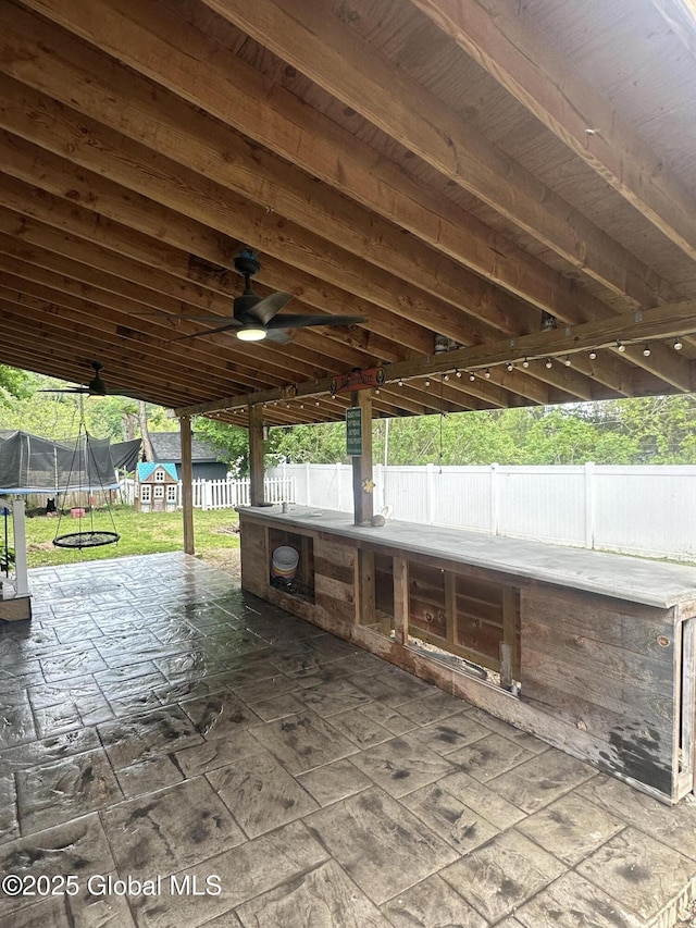 view of patio / terrace featuring a trampoline and ceiling fan