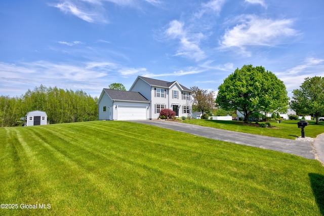 13 Peach Tree Ln, Wilton, NY 12831 - colonial house featuring driveway, an attached garage, and a front lawn