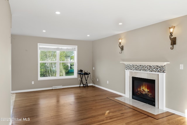 13 Peach Tree Ln, Wilton, NY 12831 - unfurnished living room with a tile fireplace, wood finished floors, recessed lighting, and baseboards