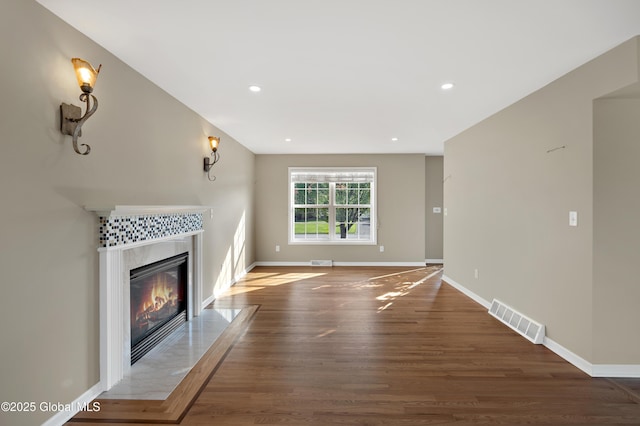 13 Peach Tree Ln, Wilton, NY 12831 - unfurnished living room featuring a fireplace, wood finished floors, baseboards, and recessed lighting