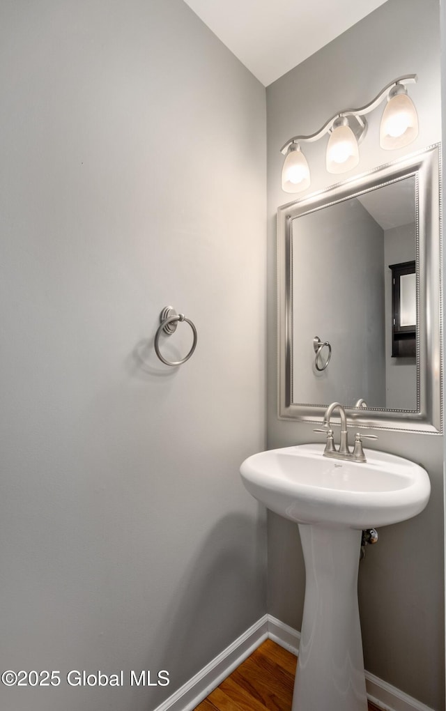 13 Peach Tree Ln, Wilton, NY 12831 - bathroom with baseboards, wood finished floors, and a sink