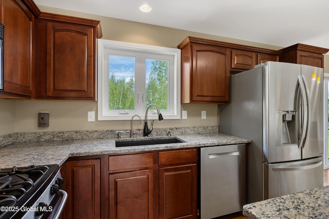 13 Peach Tree Ln, Wilton, NY 12831 - kitchen featuring stainless steel appliances, a sink, light stone countertops, and recessed lighting