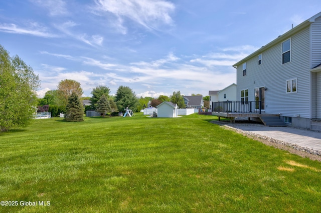 13 Peach Tree Ln, Wilton, NY 12831 - view of green lawn featuring a wooden deck