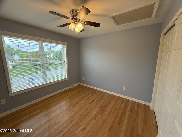13 Peach Tree Ln, Wilton, NY 12831 - unfurnished room with attic access, light wood-type flooring, baseboards, and ceiling fan