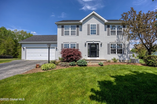 13 Peach Tree Ln, Wilton, NY 12831 - colonial inspired home featuring asphalt driveway, a garage, and a front yard