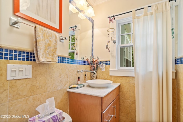 2 Loudon Pkwy, Colonie, NY 12211 - bathroom featuring tile walls, vanity, wainscoting, and ornamental molding