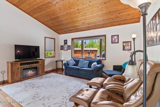 2158 State Route 29, Greenwich, NY 12834 - living room featuring wooden ceiling, wood finished floors, baseboards, a glass covered fireplace, and high vaulted ceiling