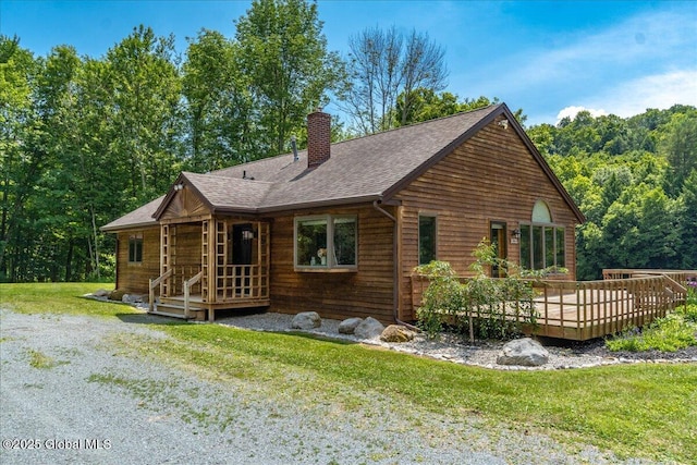 2158 State Route 29, Greenwich, NY 12834 - view of front of home with a chimney, a front yard, a wooden deck, and roof with shingles