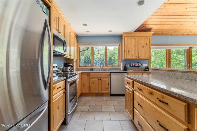 2158 State Route 29, Greenwich, NY 12834 - kitchen featuring stainless steel appliances, a sink, dark stone countertops, recessed lighting, and light brown cabinetry