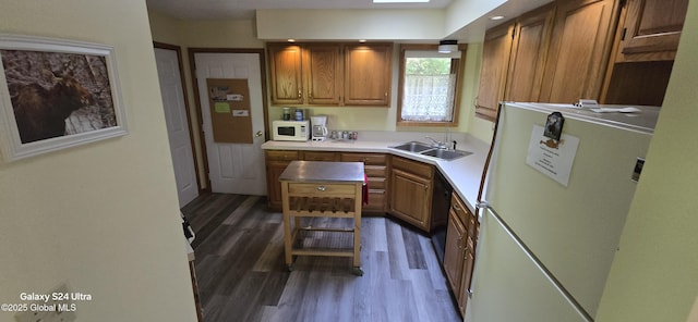 1758 US Route 9, Schroon, NY 12870 - kitchen with white appliances, a sink, dark wood-style floors, brown cabinetry, and light countertops