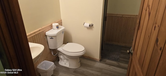 1758 US Route 9, Schroon, NY 12870 - half bathroom with wainscoting, wood finished floors, toilet, and wooden walls