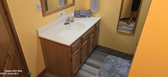 1758 US Route 9, Schroon, NY 12870 - bathroom with vanity, wood finished floors, and baseboards