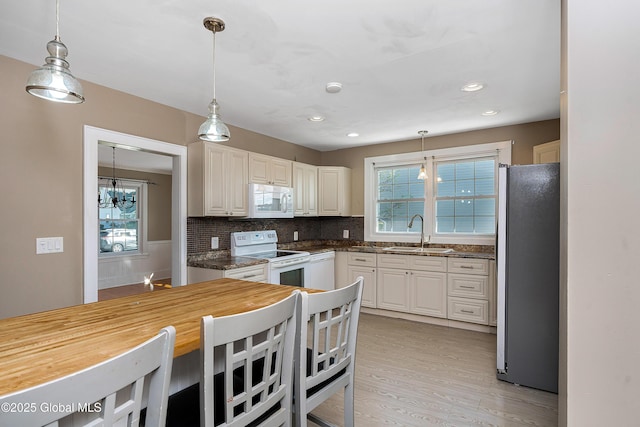 58 Old Loudon Rd, Colonie, NY 12110 - kitchen featuring white appliances, a sink, butcher block counters, healthy amount of natural light, and recessed lighting