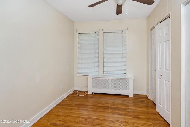 58 Old Loudon Rd, Colonie, NY 12110 - unfurnished bedroom featuring radiator, light wood-type flooring, and baseboards
