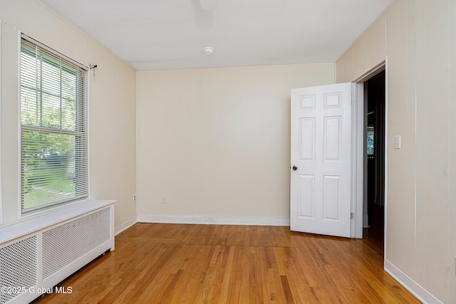 58 Old Loudon Rd, Colonie, NY 12110 - unfurnished room featuring radiator, light wood-style floors, and baseboards