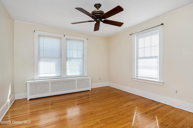 58 Old Loudon Rd, Colonie, NY 12110 - unfurnished room with radiator heating unit, crown molding, healthy amount of natural light, light wood-style flooring, and a ceiling fan