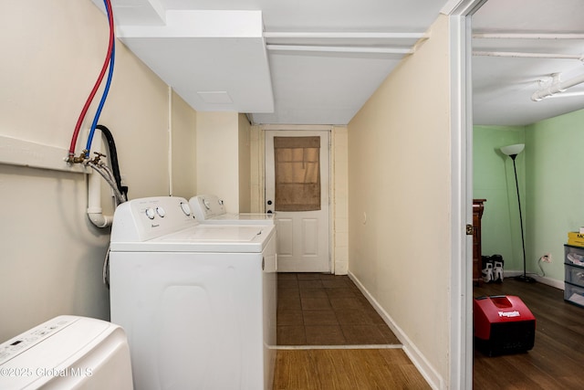 58 Old Loudon Rd, Colonie, NY 12110 - laundry area featuring washing machine and clothes dryer, wood finished floors, and baseboards