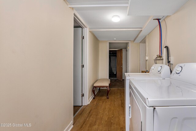 58 Old Loudon Rd, Colonie, NY 12110 - laundry area with washing machine and clothes dryer, wood finished floors, and baseboards