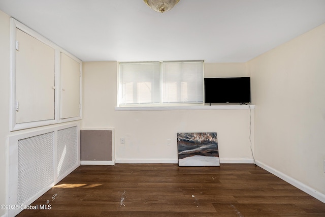 58 Old Loudon Rd, Colonie, NY 12110 - unfurnished living room featuring wood finished floors and baseboards