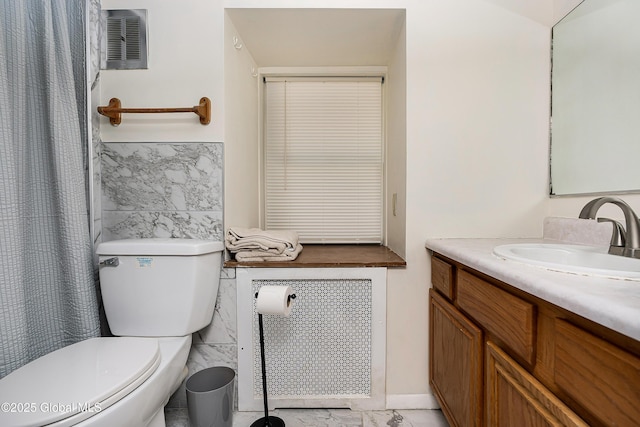 58 Old Loudon Rd, Colonie, NY 12110 - bathroom with tile walls, toilet, marble finish floors, vanity, and radiator heating unit