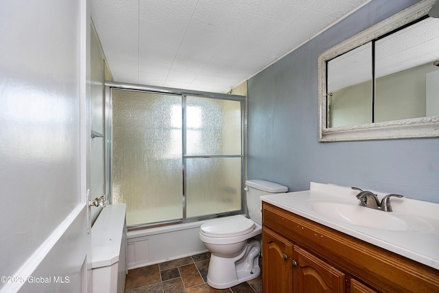 58 Old Loudon Rd, Colonie, NY 12110 - bathroom with toilet, vanity, combined bath / shower with glass door, and stone finish flooring