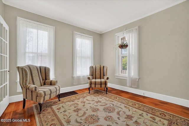 302 S William St, Johnstown, NY 12095 - sitting room with ornamental molding and wood finished floors