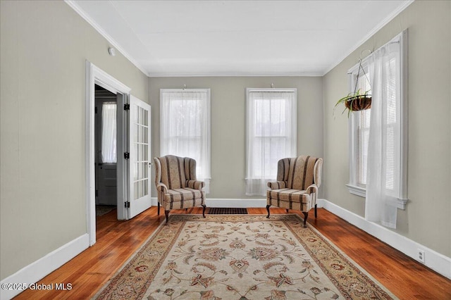 302 S William St, Johnstown, NY 12095 - sitting room with crown molding and wood finished floors