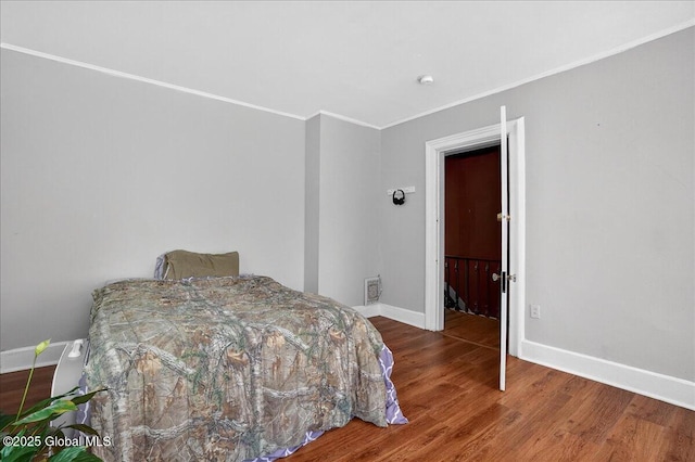 302 S William St, Johnstown, NY 12095 - bedroom with wood finished floors and ornamental molding