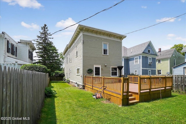 302 S William St, Johnstown, NY 12095 - back of property featuring a wooden deck and a fenced backyard