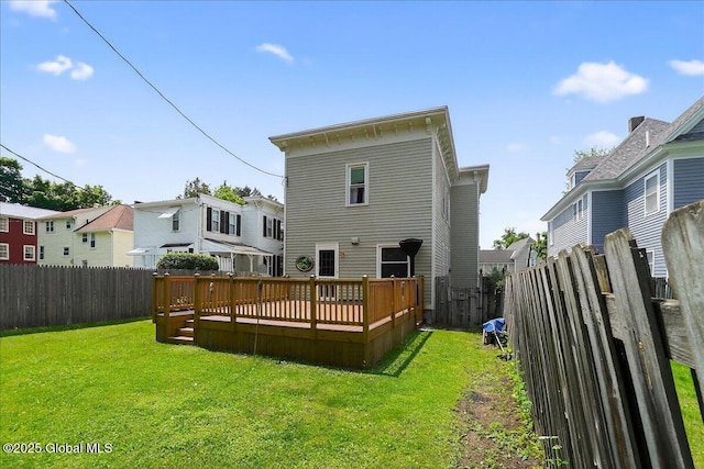 302 S William St, Johnstown, NY 12095 - rear view of property featuring a fenced backyard, a deck, and a residential view
