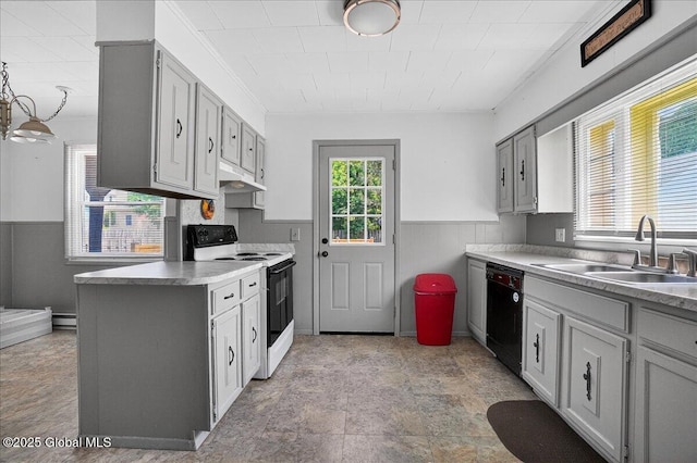 302 S William St, Johnstown, NY 12095 - kitchen featuring electric range, black dishwasher, under cabinet range hood, a wainscoted wall, and gray cabinets