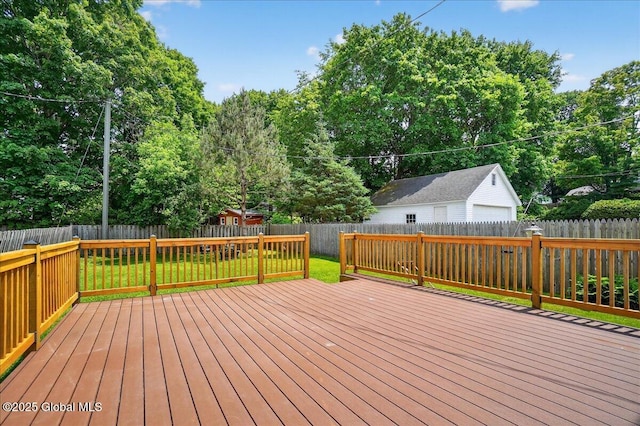 302 S William St, Johnstown, NY 12095 - wooden deck featuring a garage, a fenced backyard, and view of wooded area