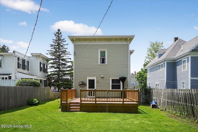 302 S William St, Johnstown, NY 12095 - rear view of property featuring a fenced backyard and a deck