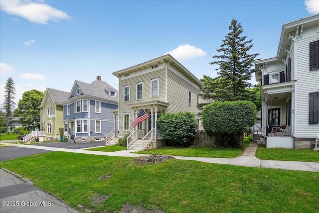 302 S William St, Johnstown, NY 12095 - italianate-style house featuring a residential view and a front yard