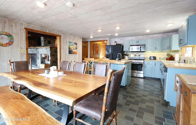 745 Adirondack Rd, Schroon Lake, NY 12870 - dining area with dark floors and wooden walls
