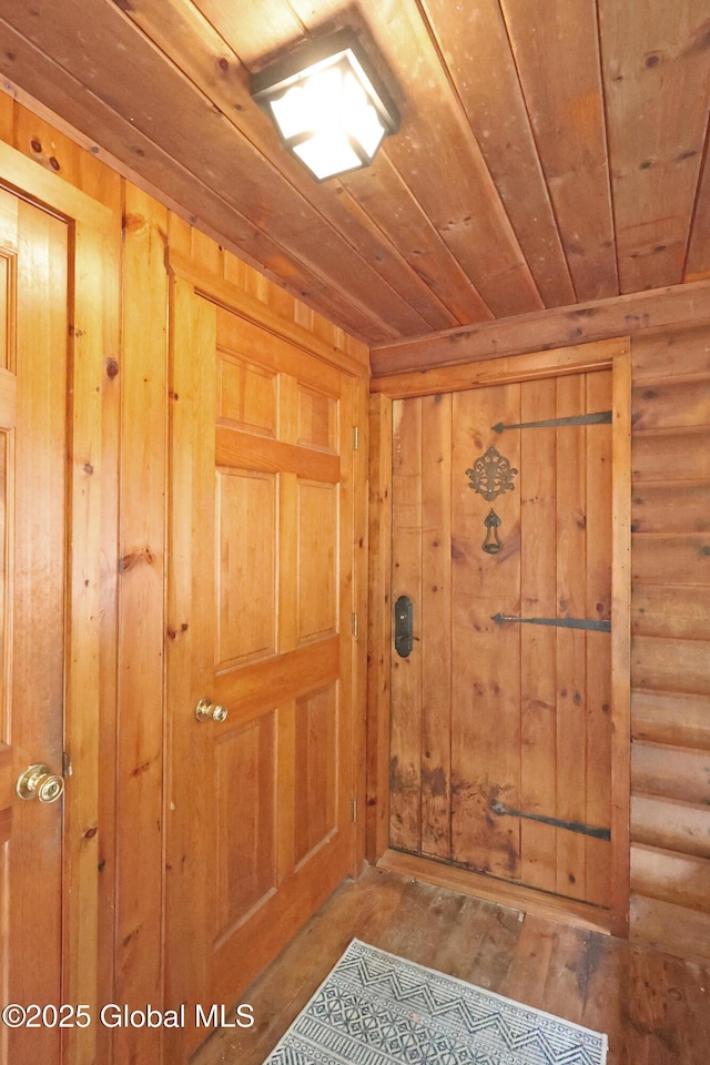 745 Adirondack Rd, Schroon Lake, NY 12870 - foyer with wood ceiling, rustic walls, and hardwood / wood-style flooring