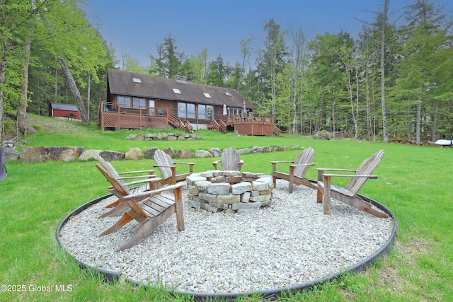 745 Adirondack Rd, Schroon Lake, NY 12870 - view of green lawn with a fire pit and a wooden deck