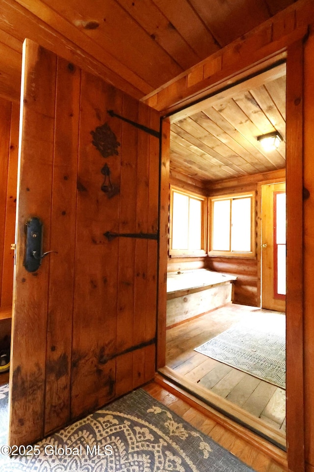 745 Adirondack Rd, Schroon Lake, NY 12870 - bathroom with hardwood / wood-style floors, wooden ceiling, and wood walls