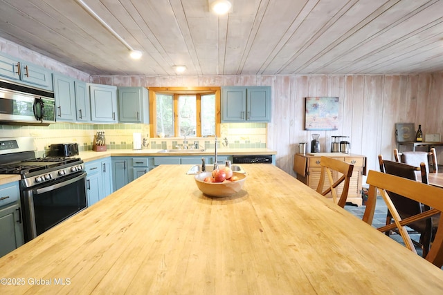 745 Adirondack Rd, Schroon Lake, NY 12870 - kitchen featuring stainless steel appliances, butcher block countertops, a sink, and wood ceiling