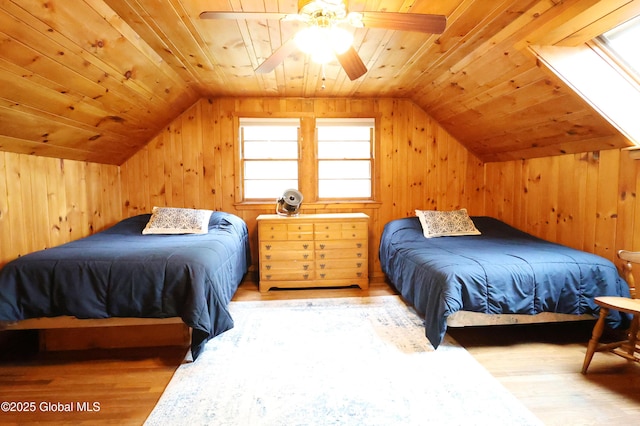 745 Adirondack Rd, Schroon Lake, NY 12870 - bedroom featuring wood finished floors, wooden ceiling, vaulted ceiling, wood walls, and a ceiling fan