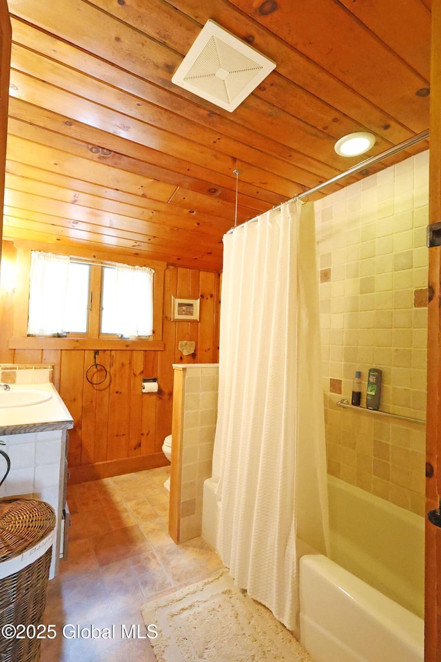 745 Adirondack Rd, Schroon Lake, NY 12870 - bathroom featuring wood ceiling, shower / bath combo with shower curtain, toilet, vanity, and tile patterned flooring