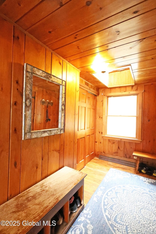 745 Adirondack Rd, Schroon Lake, NY 12870 - corridor with wooden ceiling, wood finished floors, wood walls, and a baseboard radiator