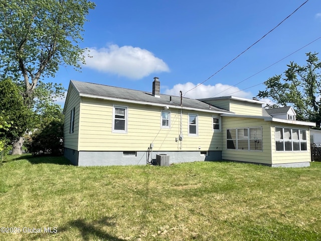 44 Park Ave, Colonie, NY 12110 - rear view of house featuring a chimney and a yard