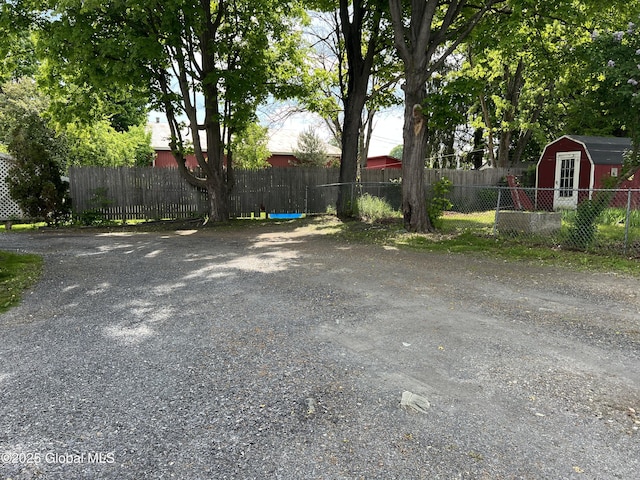 11 Williams St, Granville, NY 12832 - view of yard with fence, an outdoor structure, and a storage unit