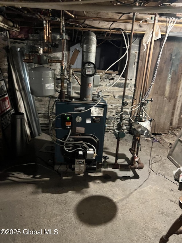 11 Williams St, Granville, NY 12832 - utility room with a heating unit