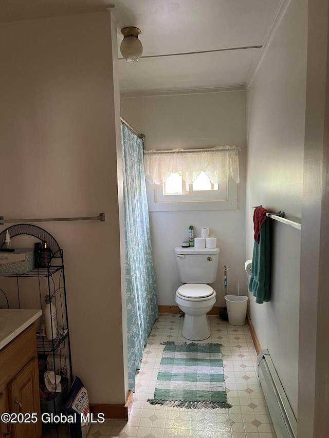 11 Williams St, Granville, NY 12832 - full bathroom with a baseboard heating unit, toilet, tile patterned floors, vanity, and curtained shower