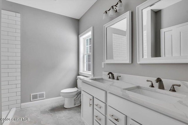 24 Nichols Rd, Wilton, NY 12831 - full bathroom with toilet, baseboards, double vanity, marble finish floors, and tiled shower