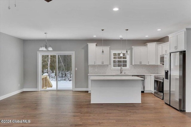 24 Nichols Rd, Wilton, NY 12831 - kitchen featuring appliances with stainless steel finishes, backsplash, baseboards, light countertops, and recessed lighting