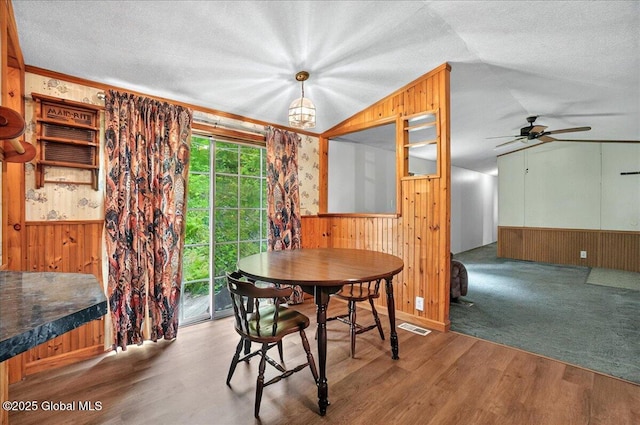 207 State Highway 5s, Florida, NY 12137 - dining area with wooden walls, lofted ceiling, wainscoting, a ceiling fan, and wood finished floors